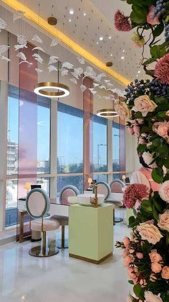 Le Mème Spa manicure bar framed by floral installation
